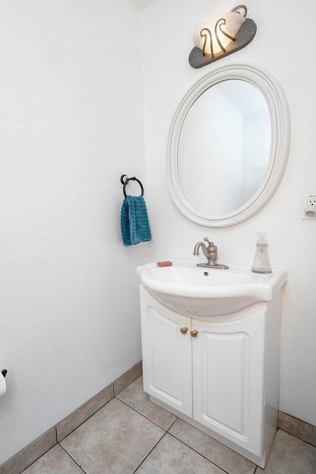 217 Steeple Ct, Johnson Creek, WI 53038 - bathroom featuring baseboards, vanity, and tile patterned flooring