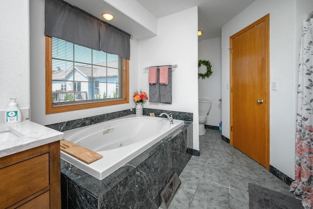 217 Steeple Ct, Johnson Creek, WI 53038 - full bath with toilet, a whirlpool tub, vanity, and tile patterned floors