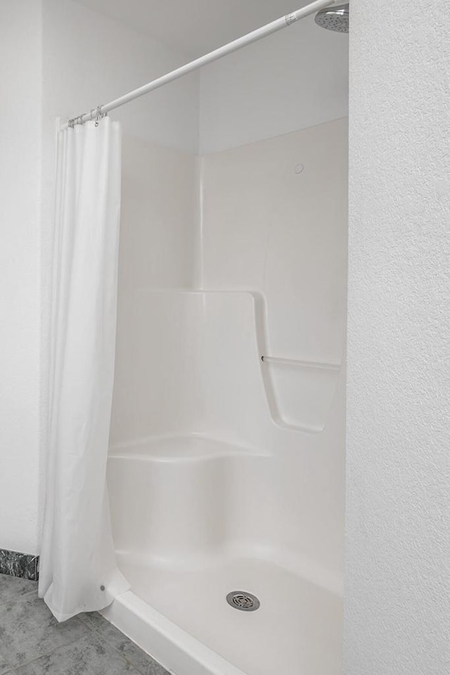 217 Steeple Ct, Johnson Creek, WI 53038 - full bathroom featuring a shower with shower curtain