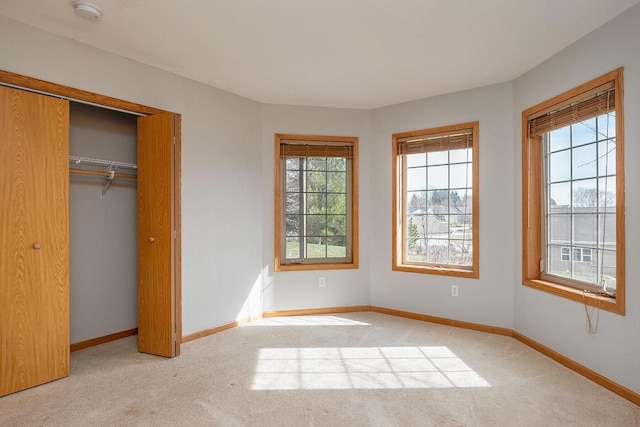 217 Steeple Ct, Johnson Creek, WI 53038 - unfurnished bedroom with light colored carpet, baseboards, and a closet
