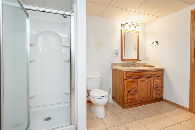 217 Steeple Ct, Johnson Creek, WI 53038 - bathroom featuring a stall shower, tile patterned floors, vanity, toilet, and a paneled ceiling