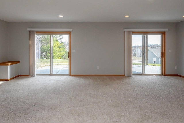 217 Steeple Ct, Johnson Creek, WI 53038 - spare room featuring baseboards, plenty of natural light, carpet flooring, and recessed lighting