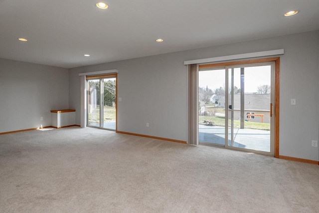 217 Steeple Ct, Johnson Creek, WI 53038 - spare room featuring baseboards, light carpet, and recessed lighting