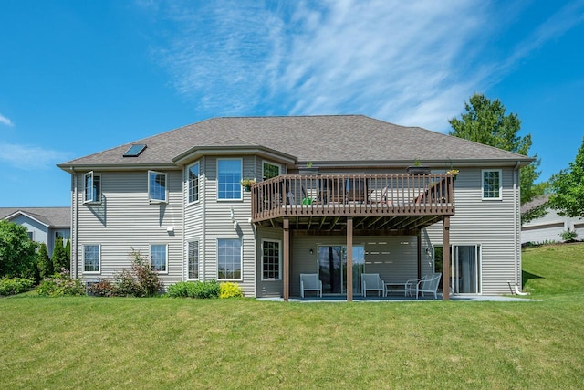 217 Steeple Ct, Johnson Creek, WI 53038 - back of house featuring a yard, a wooden deck, and a patio area