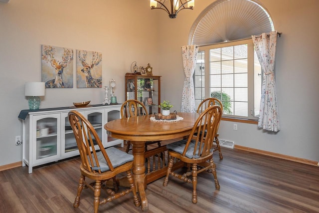 217 Steeple Ct, Johnson Creek, WI 53038 - dining space featuring wood finished floors, a chandelier, and baseboards