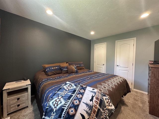 916 S Madison St Unit 9, Waupun, WI 53963 - carpeted bedroom featuring a textured ceiling, recessed lighting, and baseboards