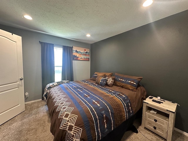 916 S Madison St Unit 9, Waupun, WI 53963 - bedroom featuring light colored carpet, recessed lighting, a textured ceiling, and baseboards