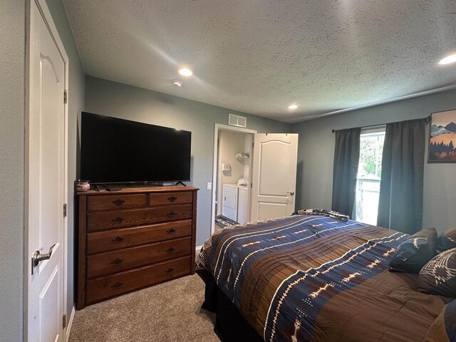 916 S Madison St Unit 9, Waupun, WI 53963 - bedroom featuring washing machine and dryer, carpet floors, a textured ceiling, and recessed lighting