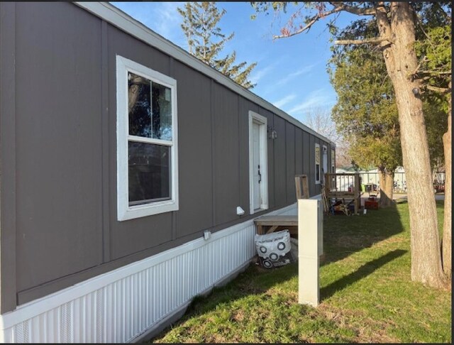 916 S Madison St Unit 9, Waupun, WI 53963 - view of home's exterior with a lawn