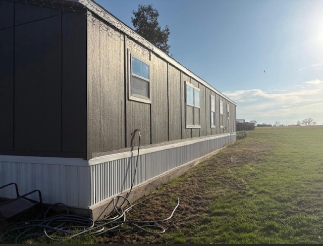 916 S Madison St Unit 9, Waupun, WI 53963 - view of home's exterior with a yard
