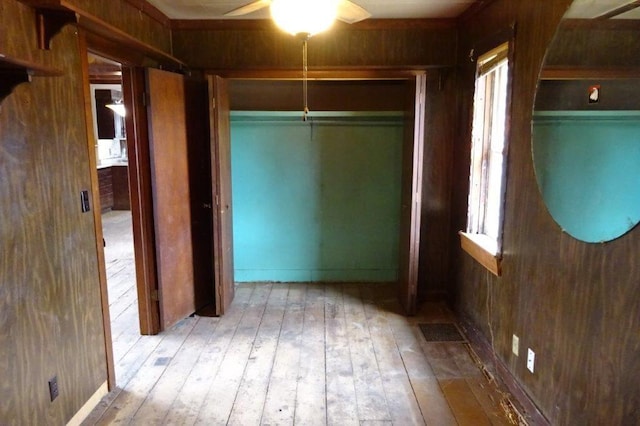 1305 La Crescent St, La Crosse, WI 54603 - hall with wood-type flooring, wooden walls, and healthy amount of natural light