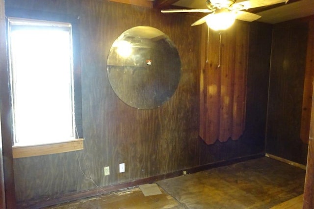 1305 La Crescent St, La Crosse, WI 54603 - unfurnished room featuring a ceiling fan and wood walls