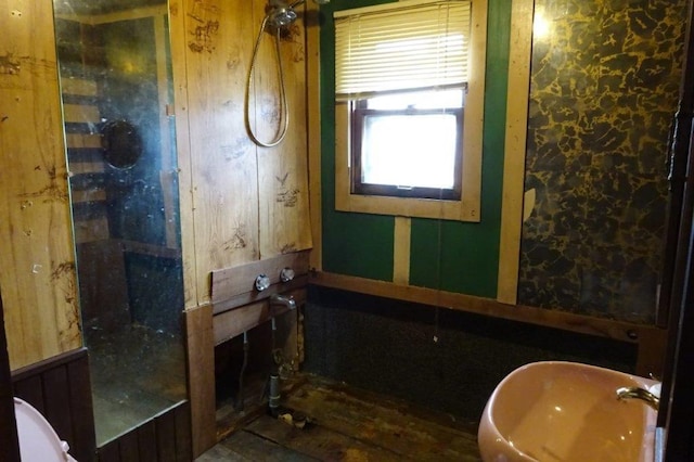 1305 La Crescent St, La Crosse, WI 54603 - bathroom with a sink, a shower, and wood finished floors