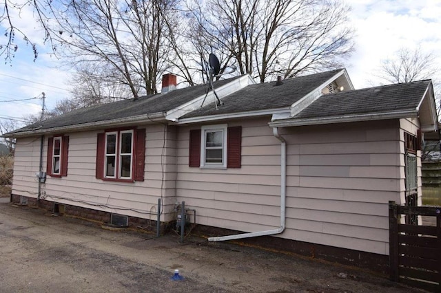 1305 La Crescent St, La Crosse, WI 54603 - view of side of property with a chimney and a shingled roof