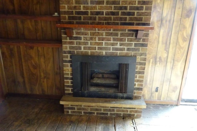 1305 La Crescent St, La Crosse, WI 54603 - detailed view of wood finished floors, wood walls, and a fireplace