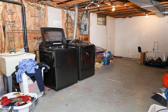 1133 Smith Ave, Antigo, WI 54409 - unfinished below grade area with washer and dryer, electric panel, and a sink