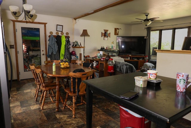 1133 Smith Ave, Antigo, WI 54409 - dining space featuring stone finish flooring, ceiling fan, and a chandelier