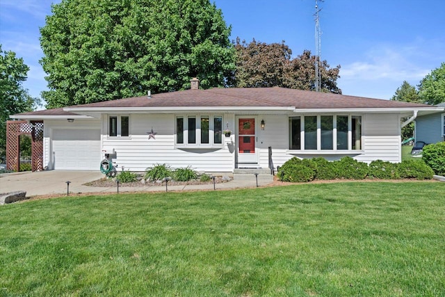 15 Wilson Ave, Fort Atkinson, WI 53538 - ranch-style home with a garage, a front lawn, and driveway