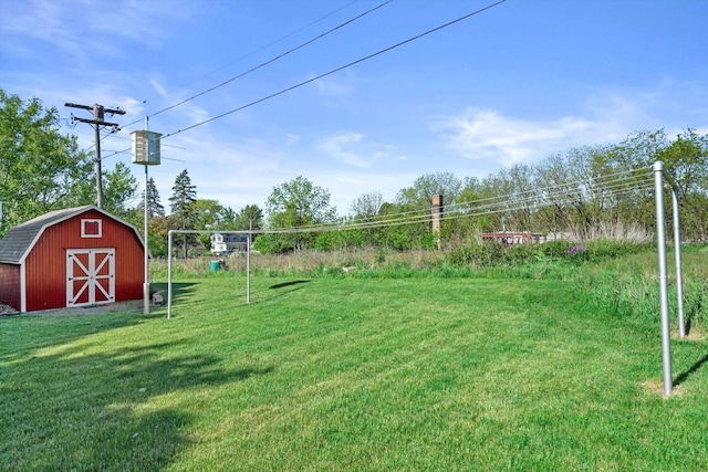 15 Wilson Ave, Fort Atkinson, WI 53538 - view of green lawn with an outdoor structure and a barn