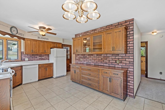 15 Wilson Ave, Fort Atkinson, WI 53538 - kitchen with white appliances, brown cabinetry, plenty of natural light, and a ceiling fan