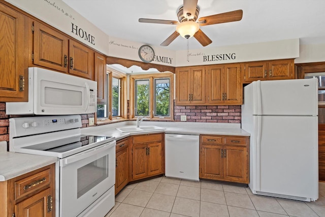 15 Wilson Ave, Fort Atkinson, WI 53538 - kitchen with white appliances, a sink, brown cabinets, and light countertops