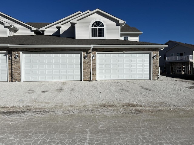 W141N9978 Seven Pines Way Unit 204, Germantown, WI 53022 - garage featuring driveway