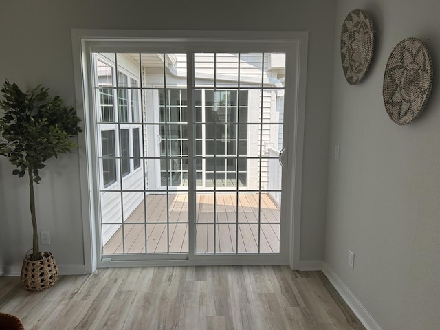 W141N9978 Seven Pines Way Unit 204, Germantown, WI 53022 - entryway with wood finished floors, baseboards, and healthy amount of natural light