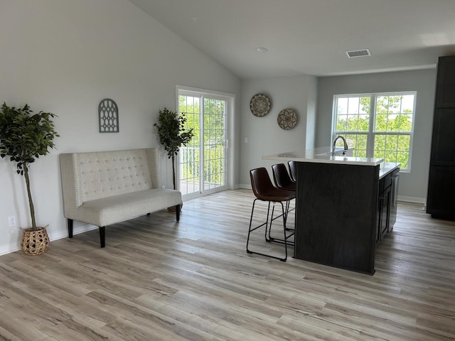W141N9978 Seven Pines Way Unit 204, Germantown, WI 53022 - dining space with vaulted ceiling, light wood-type flooring, and baseboards