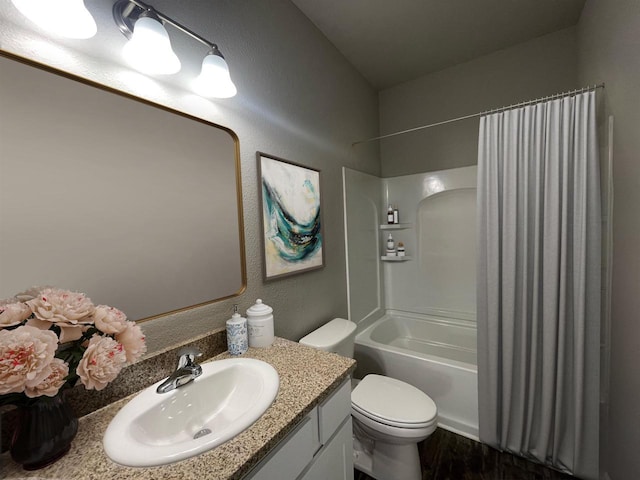 720 E Maple Beach Dr, Edgerton, WI 53534 - bathroom with vanity, shower / bath combo with shower curtain, toilet, wood finished floors, and a textured wall
