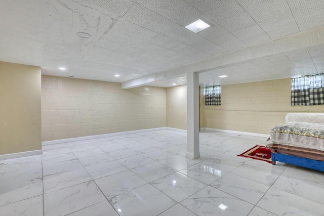 13460 Tremont St, Brookfield, WI 53005 - finished below grade area with marble finish floors, concrete block wall, and baseboards