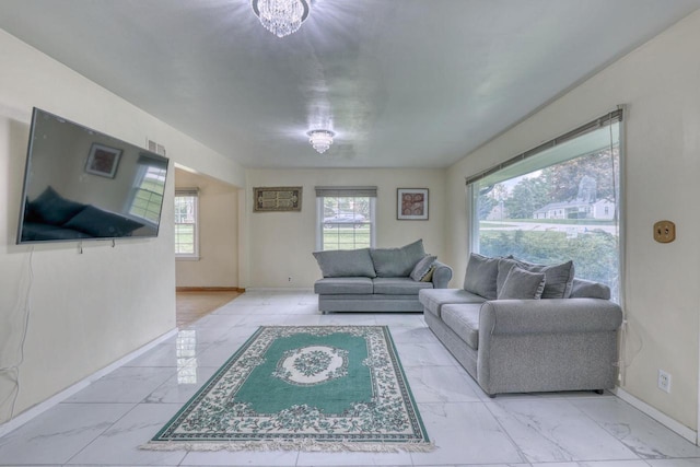 13460 Tremont St, Brookfield, WI 53005 - living area with marble look tiles and baseboards