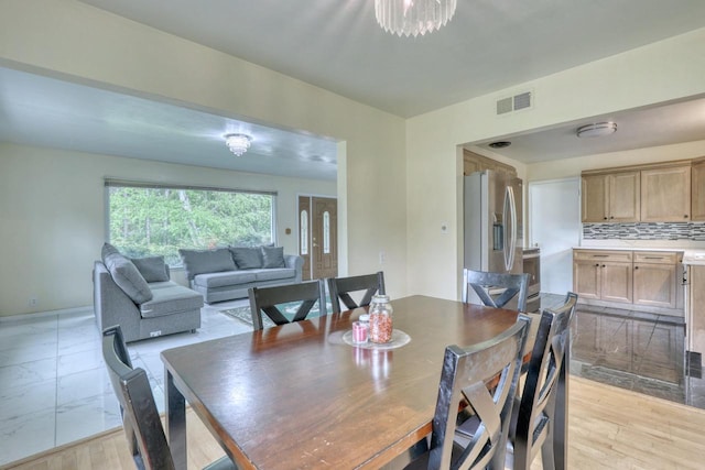 13460 Tremont St, Brookfield, WI 53005 - dining space with a chandelier