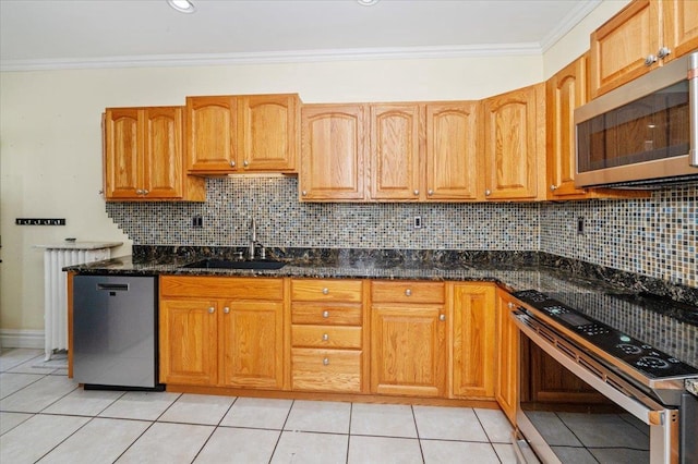 2127 Tower Ave, Superior, WI 54880 - kitchen with stainless steel appliances, a sink, crown molding, and light tile patterned floors