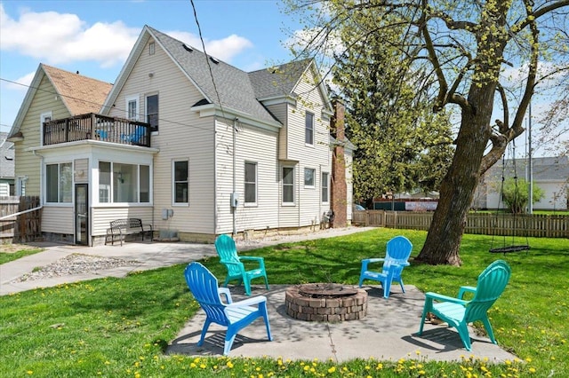 2127 Tower Ave, Superior, WI 54880 - back of property with a fire pit, a balcony, a patio area, and roof with shingles