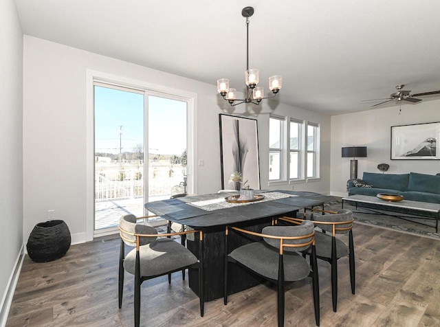 704 River Ridge Drive, Waterford, WI 53185 - dining area with baseboards, dark wood finished floors, a chandelier, and a ceiling fan