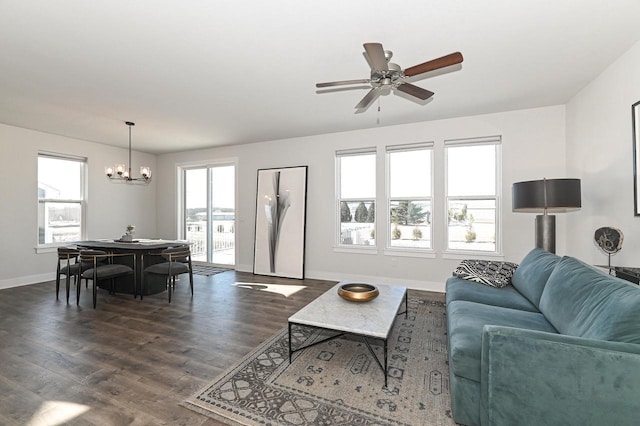 704 River Ridge Drive, Waterford, WI 53185 - living area featuring a chandelier, baseboards, dark wood-type flooring, and ceiling fan