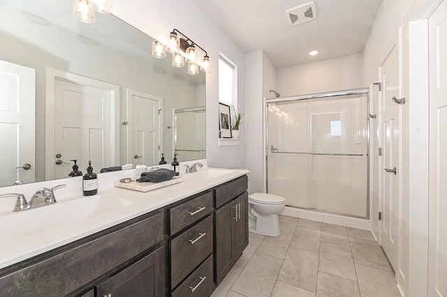 704 River Ridge Drive, Waterford, WI 53185 - full bathroom with a shower stall, double vanity, toilet, tile patterned floors, and recessed lighting