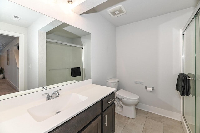 704 River Ridge Drive, Waterford, WI 53185 - full bath with vanity, a shower stall, toilet, baseboards, and tile patterned flooring