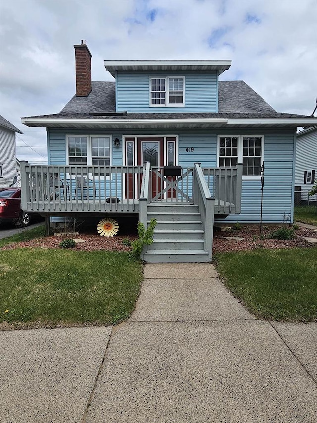 419 N 3rd Ave, Wausau, WI 54401 - view of front facade featuring covered porch, a chimney, and a shingled roof