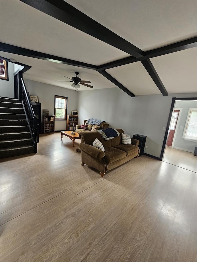 419 N 3rd Ave, Wausau, WI 54401 - living area with beamed ceiling, stairs, wood finished floors, baseboards, and a ceiling fan