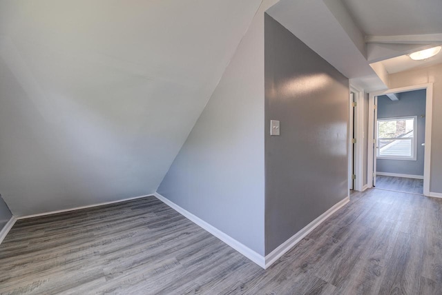 4935 N 56th St, Milwaukee, WI 53218 - bonus room with wood finished floors, baseboards, and lofted ceiling