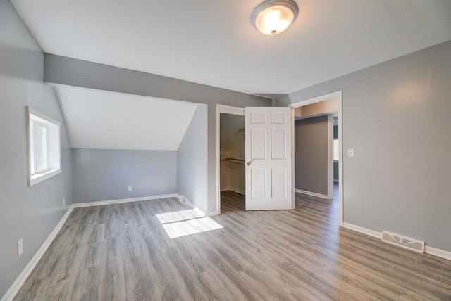 4935 N 56th St, Milwaukee, WI 53218 - bonus room with wood finished floors, baseboards, and vaulted ceiling