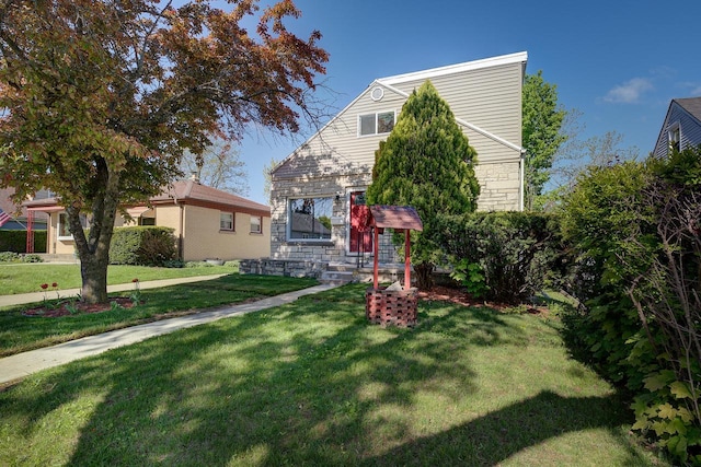 4935 N 56th St, Milwaukee, WI 53218 - view of front of property with a front lawn and stone siding