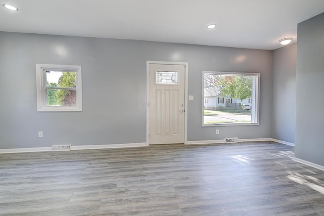 4935 N 56th St, Milwaukee, WI 53218 - entrance foyer featuring recessed lighting, healthy amount of natural light, wood finished floors, and baseboards