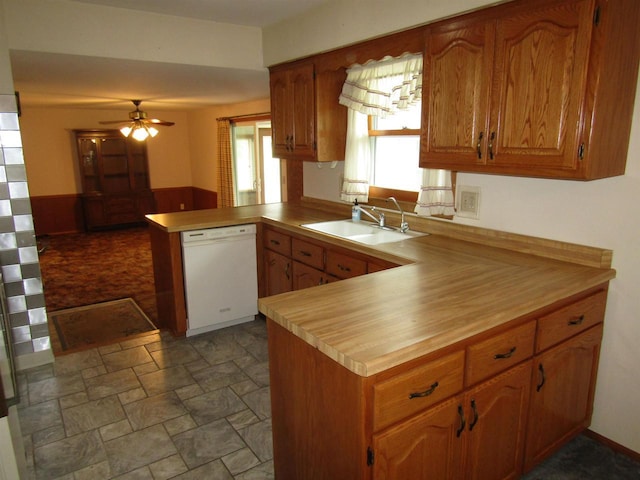 2374 S Park Ave, Beloit, WI 53511 - kitchen featuring dishwasher, a peninsula, a sink, ceiling fan, and stone finish floors