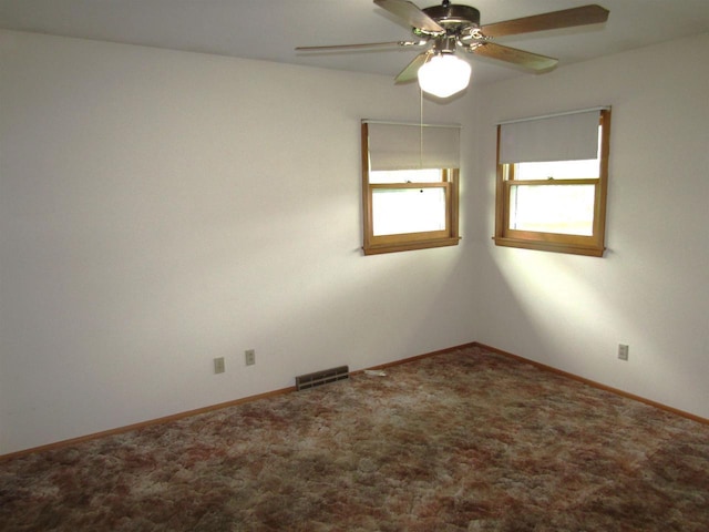 2374 S Park Ave, Beloit, WI 53511 - unfurnished room with a ceiling fan, carpet floors, and baseboards