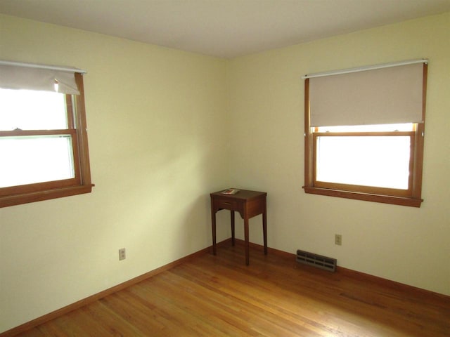2374 S Park Ave, Beloit, WI 53511 - unfurnished room featuring light wood-style flooring and baseboards