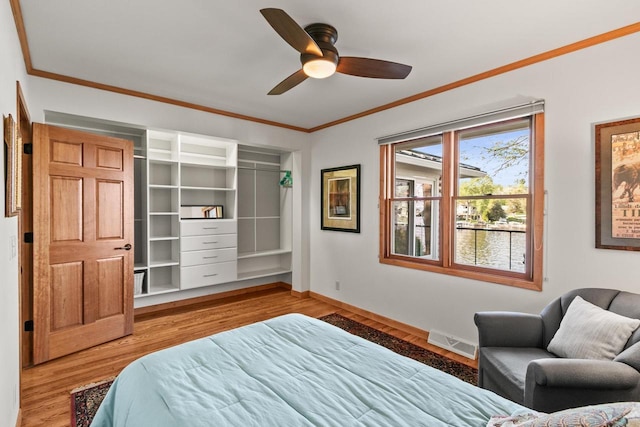 491 River St, Merrimac, WI 53561 - bedroom with ornamental molding, wood finished floors, baseboards, and ceiling fan