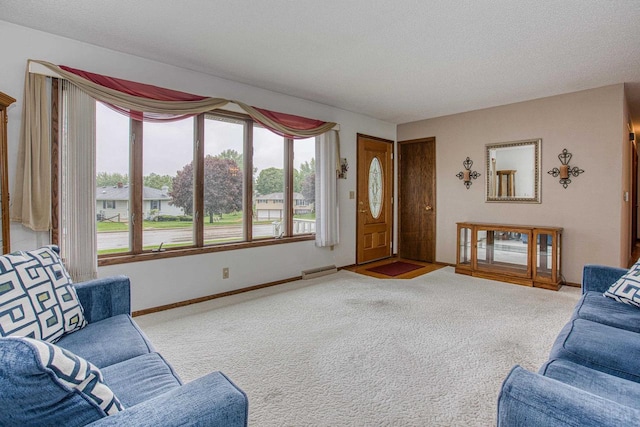 714 S Randolph St, Cuba City, WI 53807 - carpeted living room with baseboards and a textured ceiling