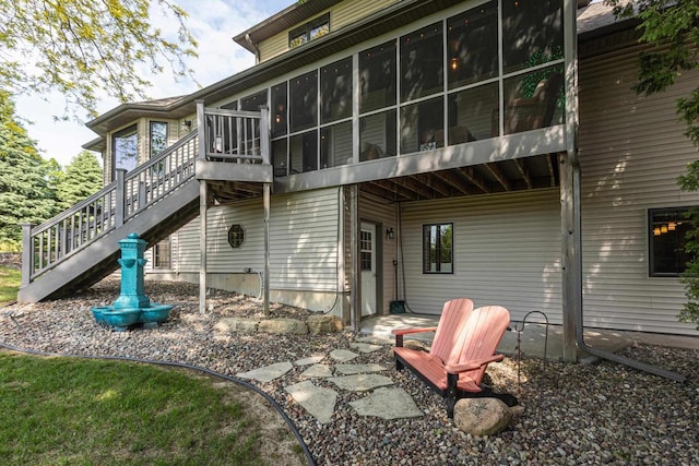 800 Ridge Ave, Platteville, WI 53818 - rear view of house featuring a sunroom and stairs